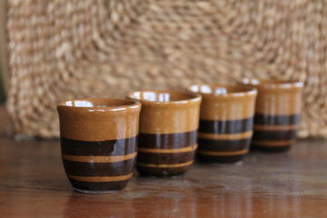 Old flask with glasses on the table