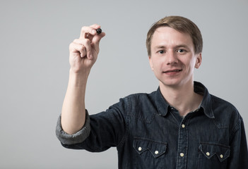 Fototapeta premium Young man with pen