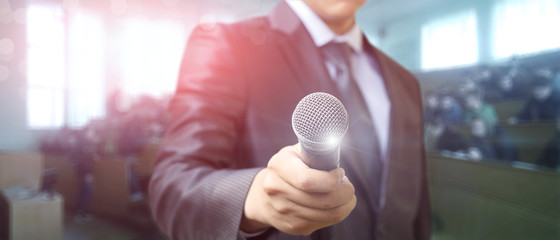 Businessman with microphones in hand .