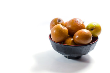 Jujube fruits close up on white background.
