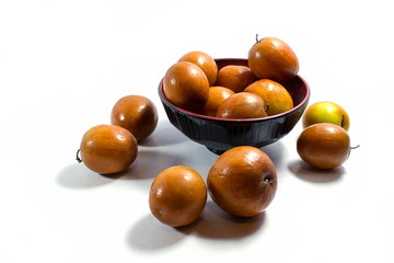 Jujube fruits close up on white background.