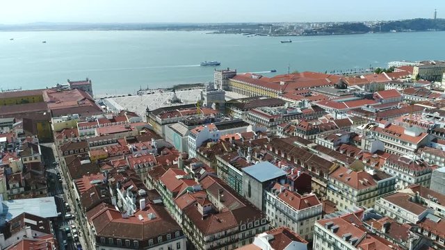 Aerial over Lisbon Portugal flight towards Commerce Square in Portuguese Praca do Comercio located situated near Tagus river square is commonly known as Terreiro do Pa&ccedil;o and popular tourist attraction