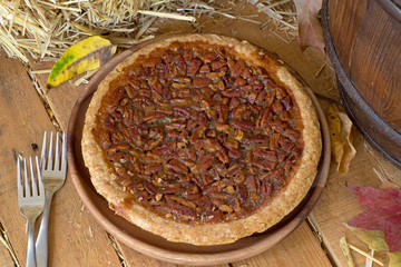 Whole Pecan Pie on a Rustic Wooden Surface
