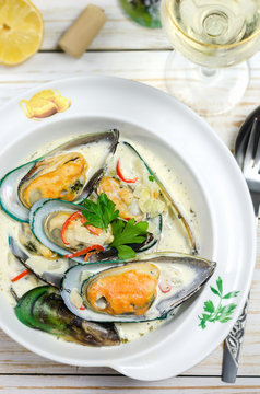 Shellfish mussels in cream sauce with white wine and chili pepper.