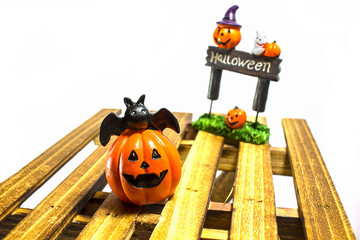 Halloween pumpkin smile and Halloween plate on wood plate : white background.