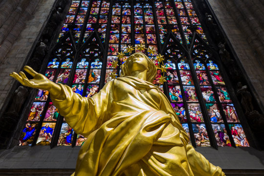 Golden madonnina statue inside Milan Cathedral