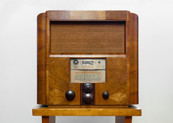Vintage old wooden radio isolated on white background.