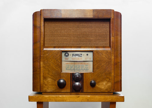 Vintage old wooden radio isolated on white background.