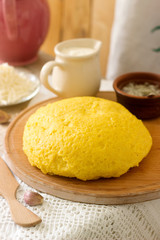Mamaliaga or polenta, a traditional dish of Moldovan, Romanian, Hungarian and Ukrainian cuisine. Porridge from corn flour. Served with brynza, sour cream and garlic sauce.