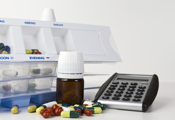 medicine boxes with pills, medicines and calculator