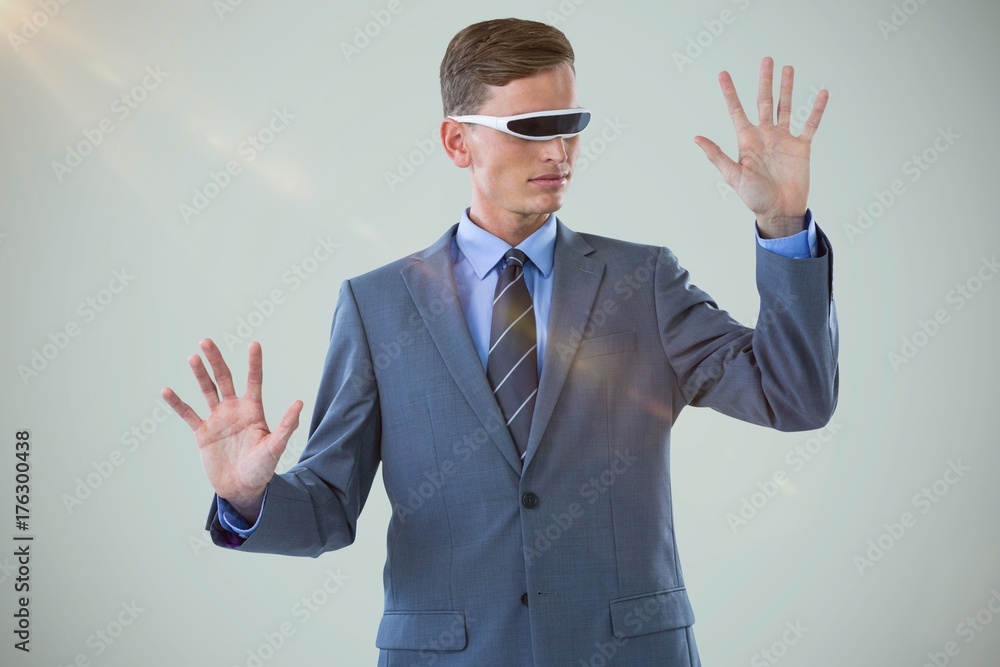 Poster Composite image of businessman imagining while using virtual