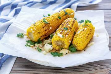 Sweet corn grilled with cheese and cilantro.