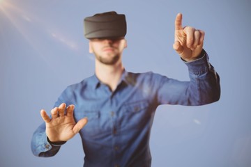 Composite image of man using a virtual reality device