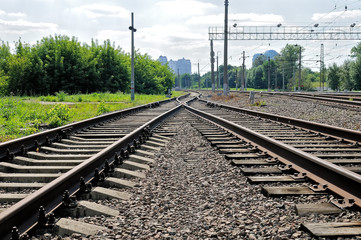 Fototapeta na wymiar Rusty rails of the abandoned railroad.