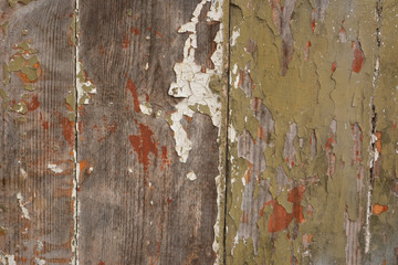  Оld wooden wall with the remains of paint and rust. Texture, background