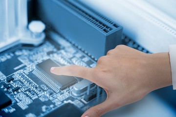 Composite image of hand of female doctor using digital screen
