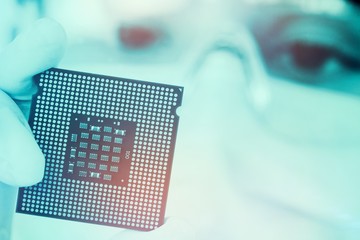 Close-up of female surgeon holding a processor