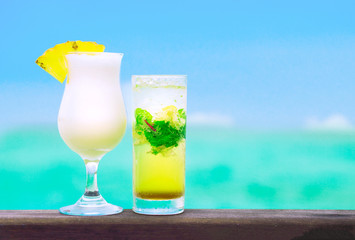 two delicious fruit cocktails by the beach