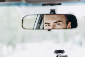 Eyes in the rear view mirror - Powered by Adobe