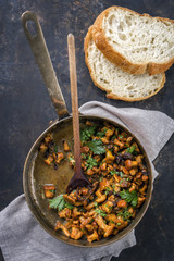 Fresh fried chanterelle in sauce as top view in a casserole