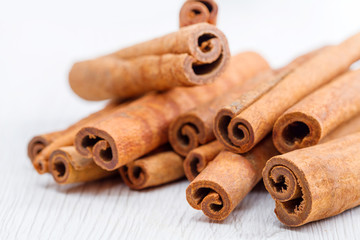 cinnamon stick on white wooden background