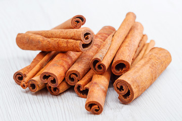 cinnamon stick on white wooden background