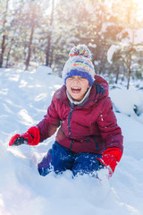 Fototapeta na wymiar Boy playing in big snow in winter.