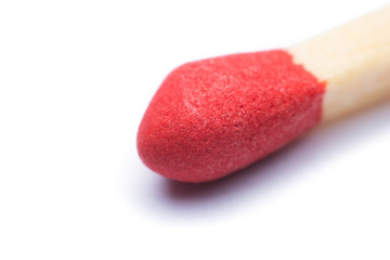 Close-up red match isolated on a white background