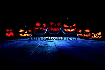 concept of Halloween. Three glowing fiery light of evil scary pumpkins flying through the air. jack...