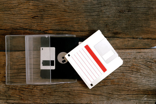floppy disk in box on wooden floor
