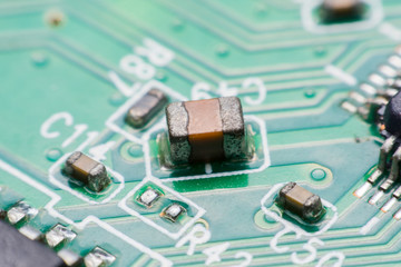 Closeup electronic hardware .Resistor and condensers assembly on the circuit board