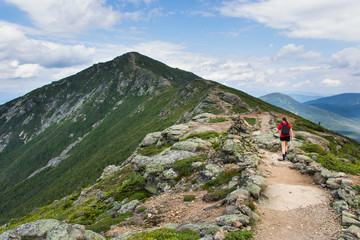 Teenage girl hiking on a beautiful mountain 

