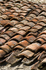 Old clay roof tiles - U-shaped tiles - Architectural background, texture, pattern.