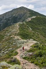 Teenage girl hiking on a beautiful mountain 
