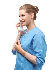 Young female receptionist talking on phone, isolated on white