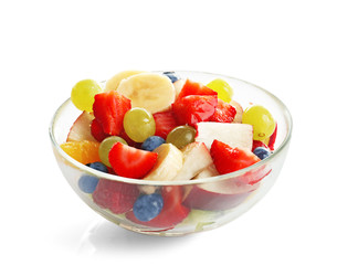 Bowl with yummy fruit salad, isolated on white