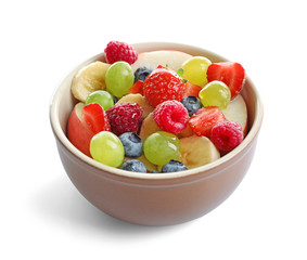 Bowl with yummy fruit salad, isolated on white