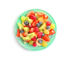 Plate with yummy fruit salad isolated on white