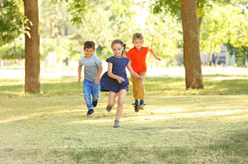 Fototapeta premium Group of children in park on sunny day