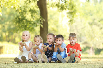 Fototapeta premium Group of children in park on sunny day