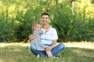 Fototapeta premium Father with daughter in park on sunny day