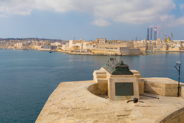 World War II Memorial, Bronze soldier lying on a catafalque overlooking the Grand Harbor and Fort St. Angelo, Valletta, Malta