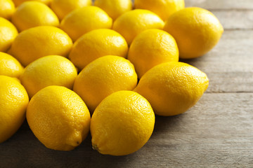 Fresh lemons on wooden table, closeup
