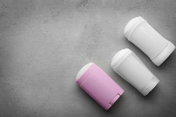 Solid deodorants for women on grey background