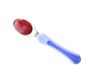 Spoon with baby food on white background