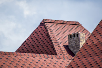 Decorative metal tile on a roof
