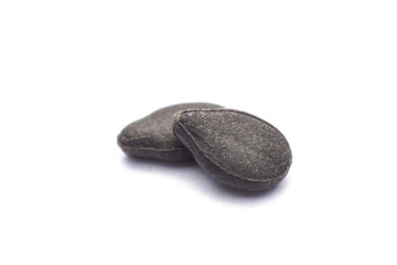 Close up pile of black sesame seeds isolated on white background