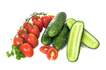 vegetables cucumbers and tomatoes on a white background