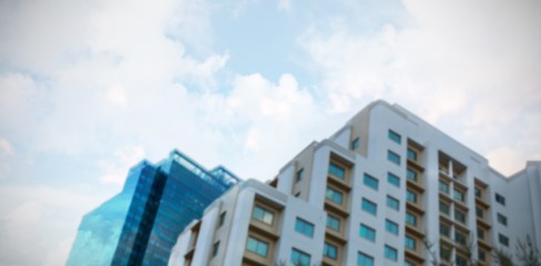 Residential buildings against cloudy sky