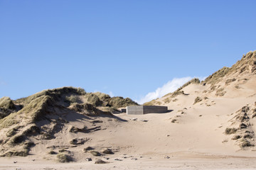 Grassy Sand Dunes at Newburgh Beach in front of Blue Sky